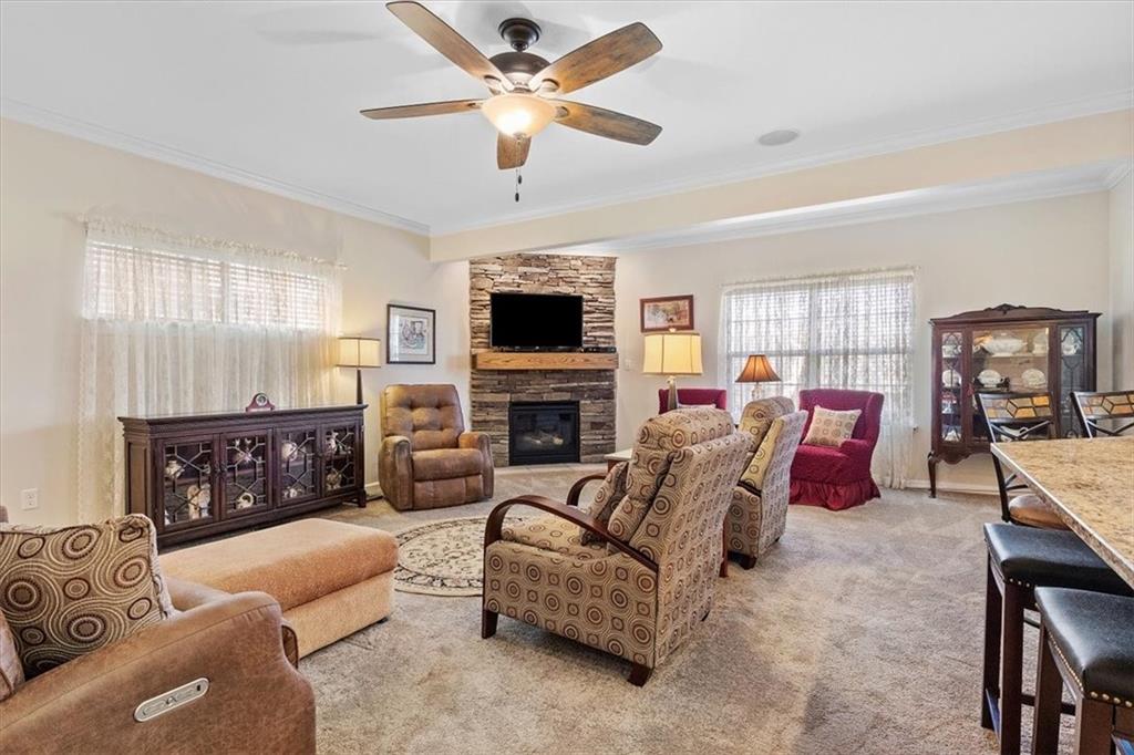 358 Wealdstone Road Cranberry Township, PA 16066 - Photo 11 of 46 a living room with furniture a fireplace and a flat screen tv