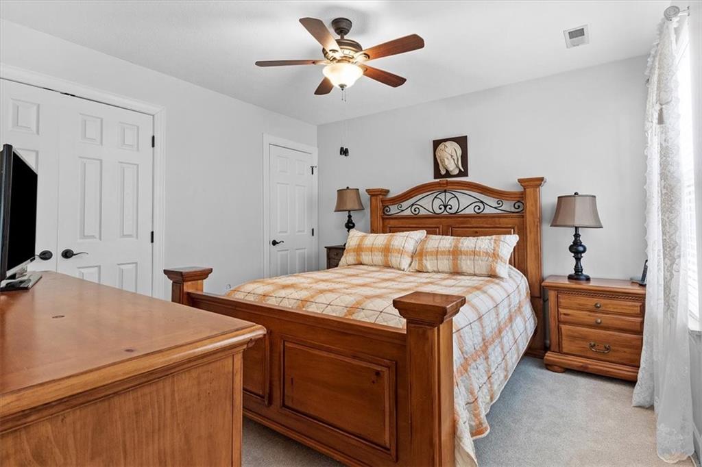 358 Wealdstone Road Cranberry Township, PA 16066 - Photo 27 of 46 a bedroom with a bed and a chandelier