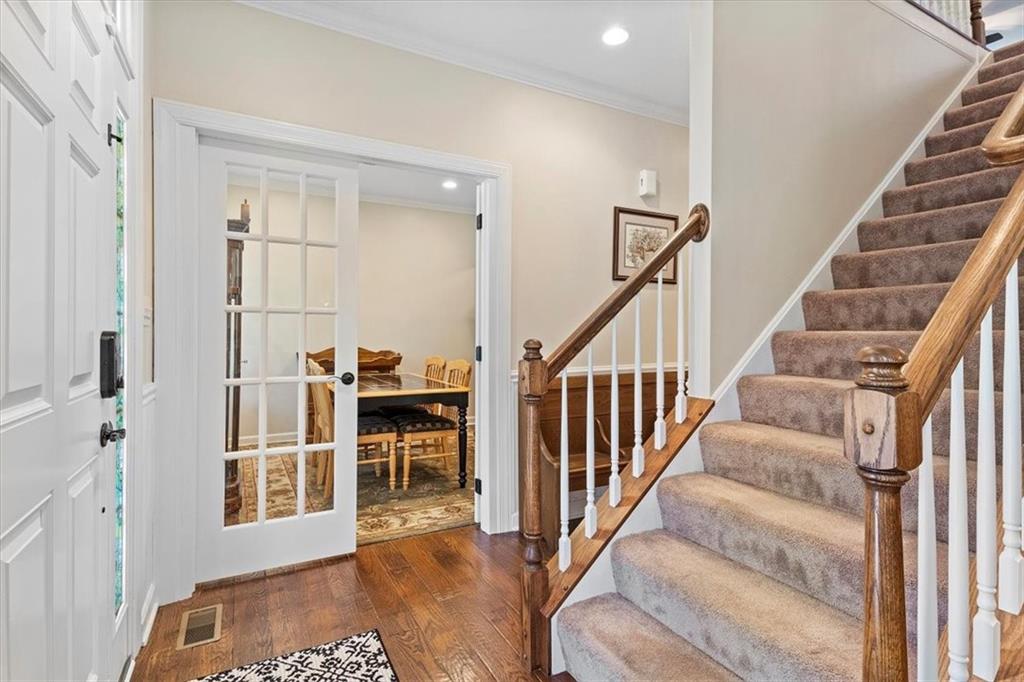 358 Wealdstone Road Cranberry Township, PA 16066 - Photo 4 of 46 a view of a hallway with wooden floor and staircase