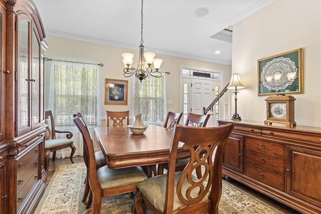 358 Wealdstone Road Cranberry Township, PA 16066 - Photo 8 of 46 a view of a dining room with furniture window and wooden floor