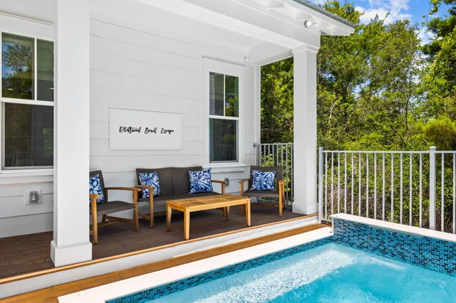 a kitchen with stainless steel appliances a stove and white cabinets