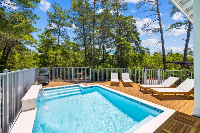 a dining room with furniture window and wooden floor