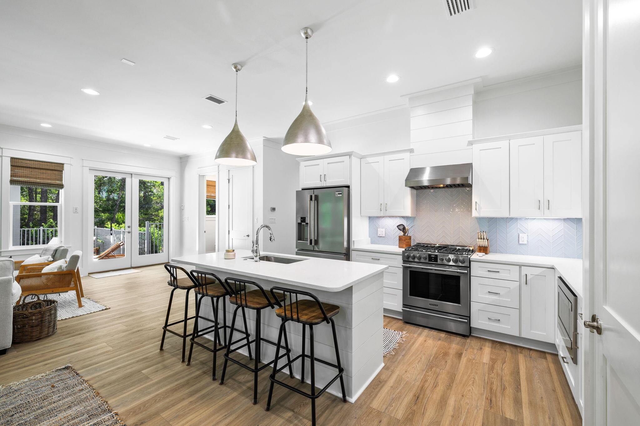 213 Spotted Dolphin Road Santa Rosa Beach, FL 32459 - Photo 20 of 72 a kitchen with stainless steel appliances granite countertop a stove a sink a stove a refrigerator dining table and chairs