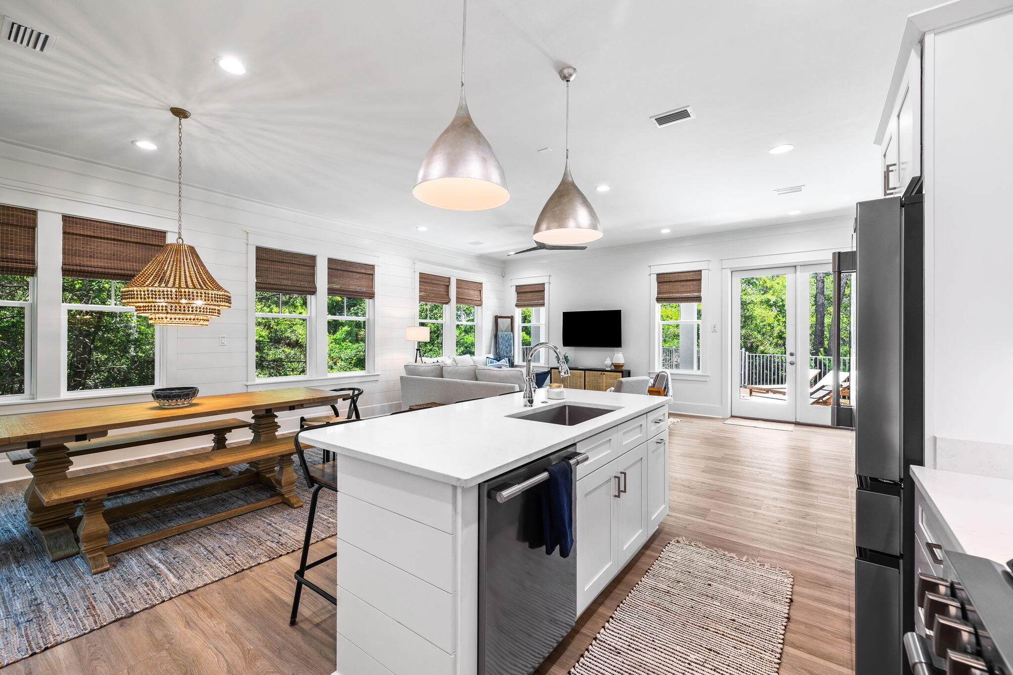 213 Spotted Dolphin Road Santa Rosa Beach, FL 32459 - Photo 23 of 72 a kitchen that has a sink a stove and a wooden floor