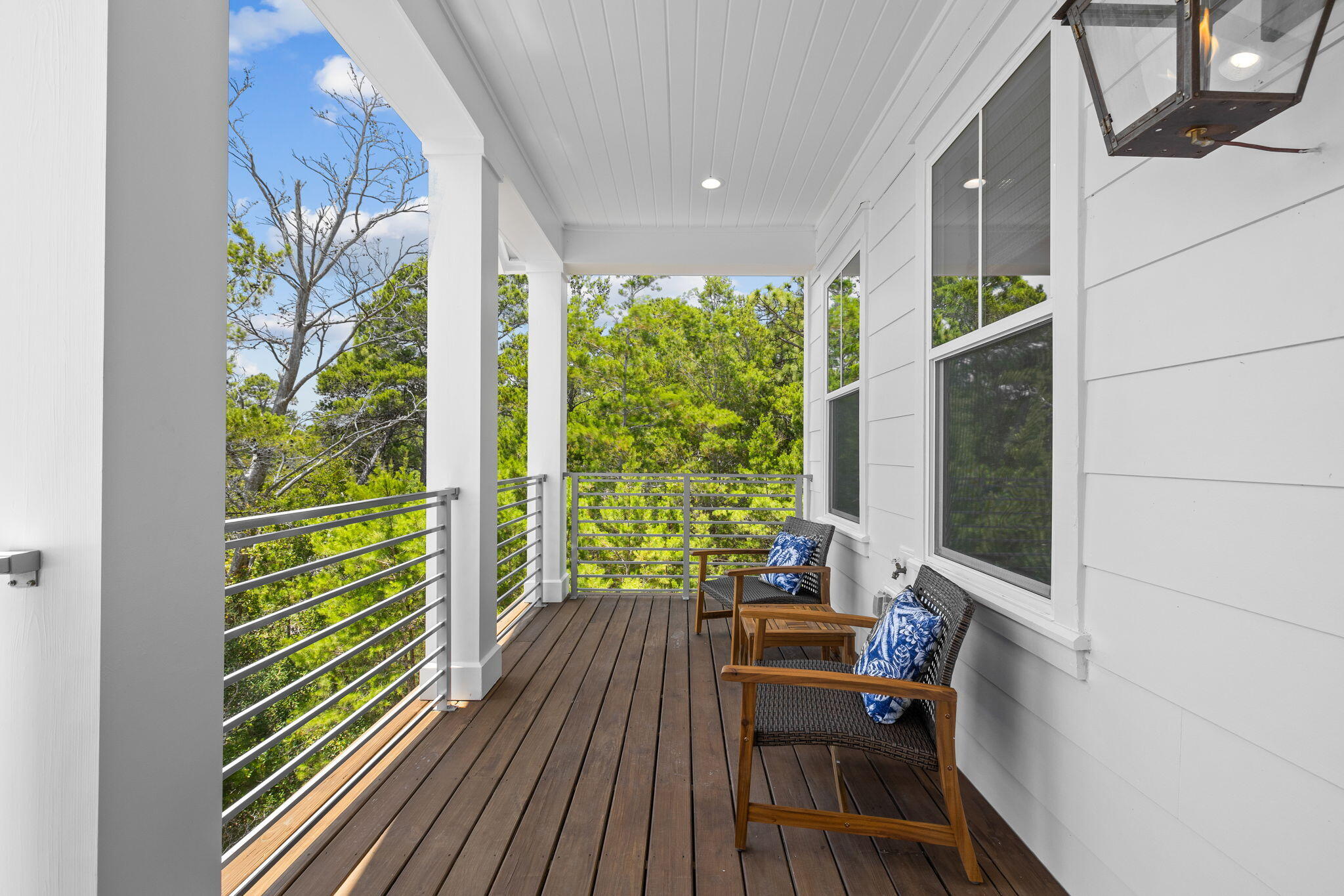 213 Spotted Dolphin Road Santa Rosa Beach, FL 32459 - Photo 54 of 72 a view of a balcony with chairs and wooden floor