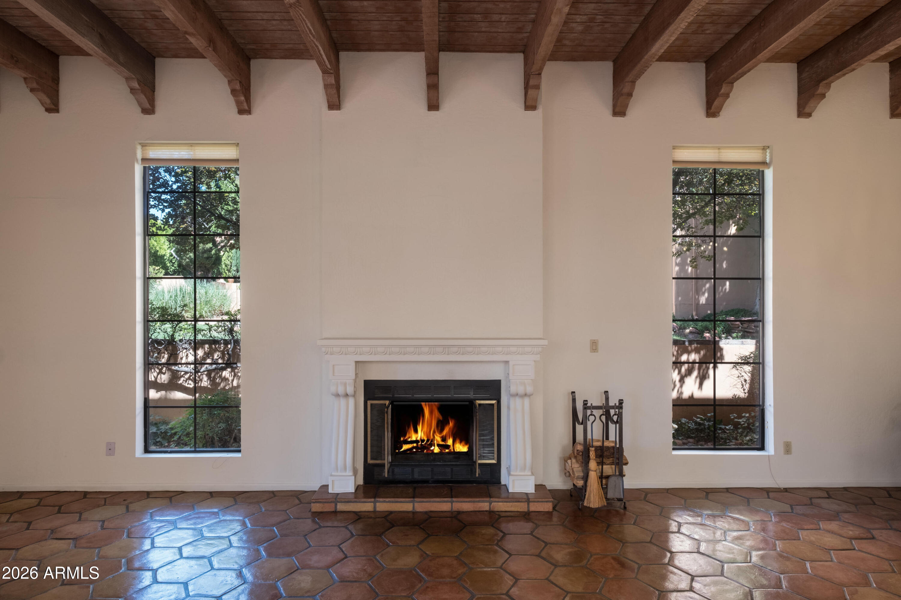 15 Ridge View Drive, Unit 17 Sedona, AZ 86351 - Photo 9 of 41 Living room, wood burning fireplace