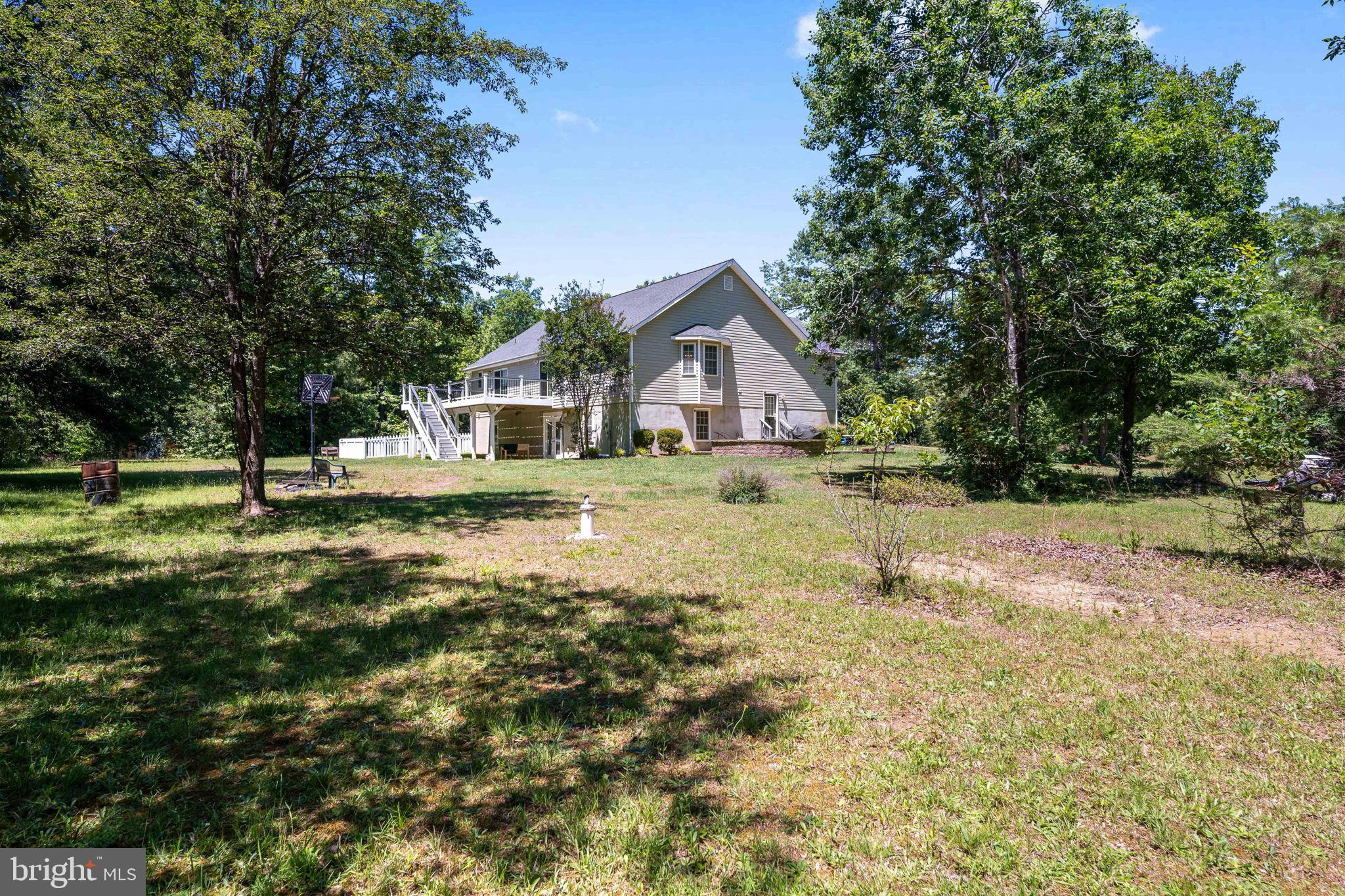 8009 Burrell Road Fredericksburg, VA 22407 - Photo 54 of 66 Serene home nestled in lush greenery.