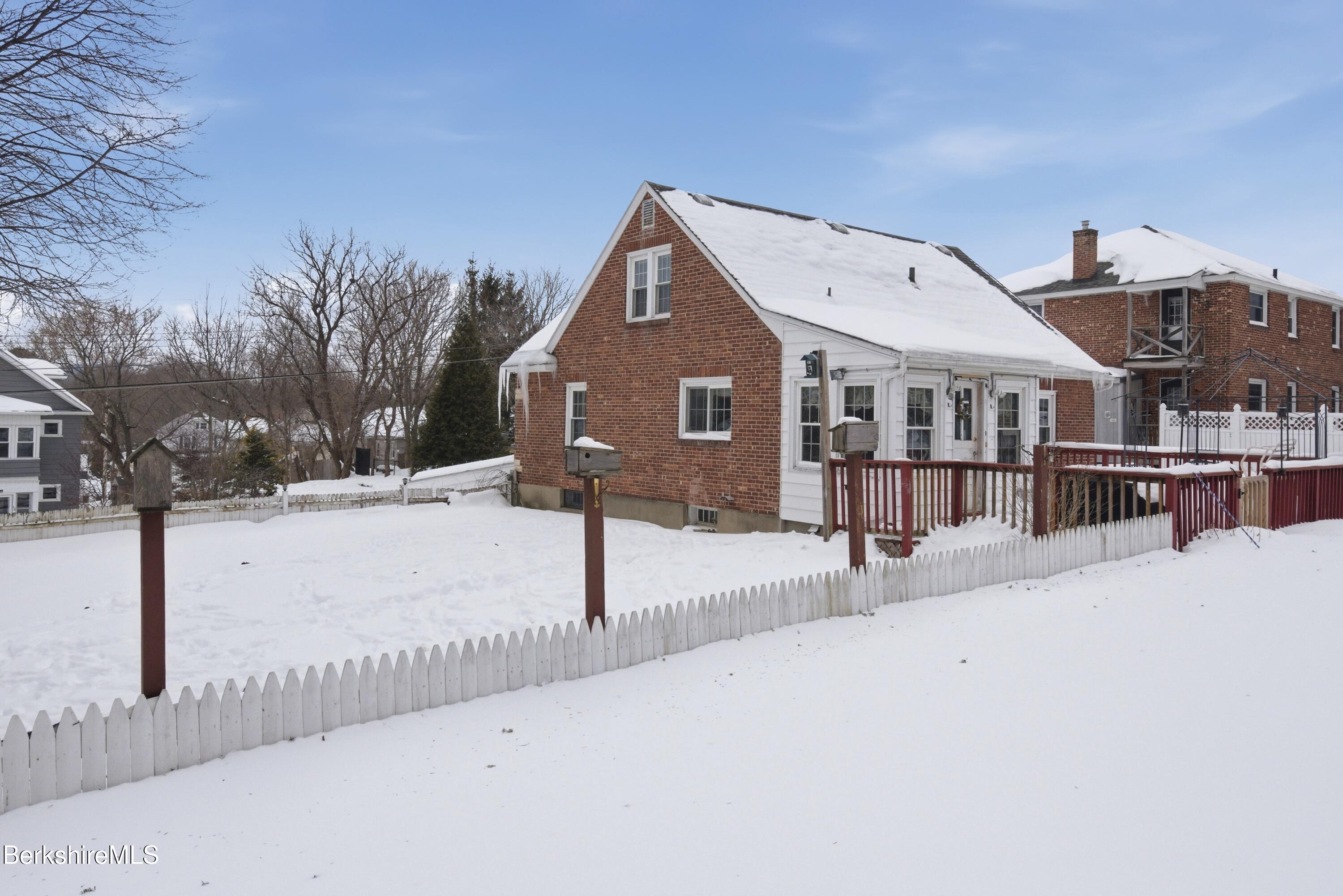 53 Edison Avenue Pittsfield, MA 01201 - Photo 43 of 45 a front view of a house with a yard covered in snow