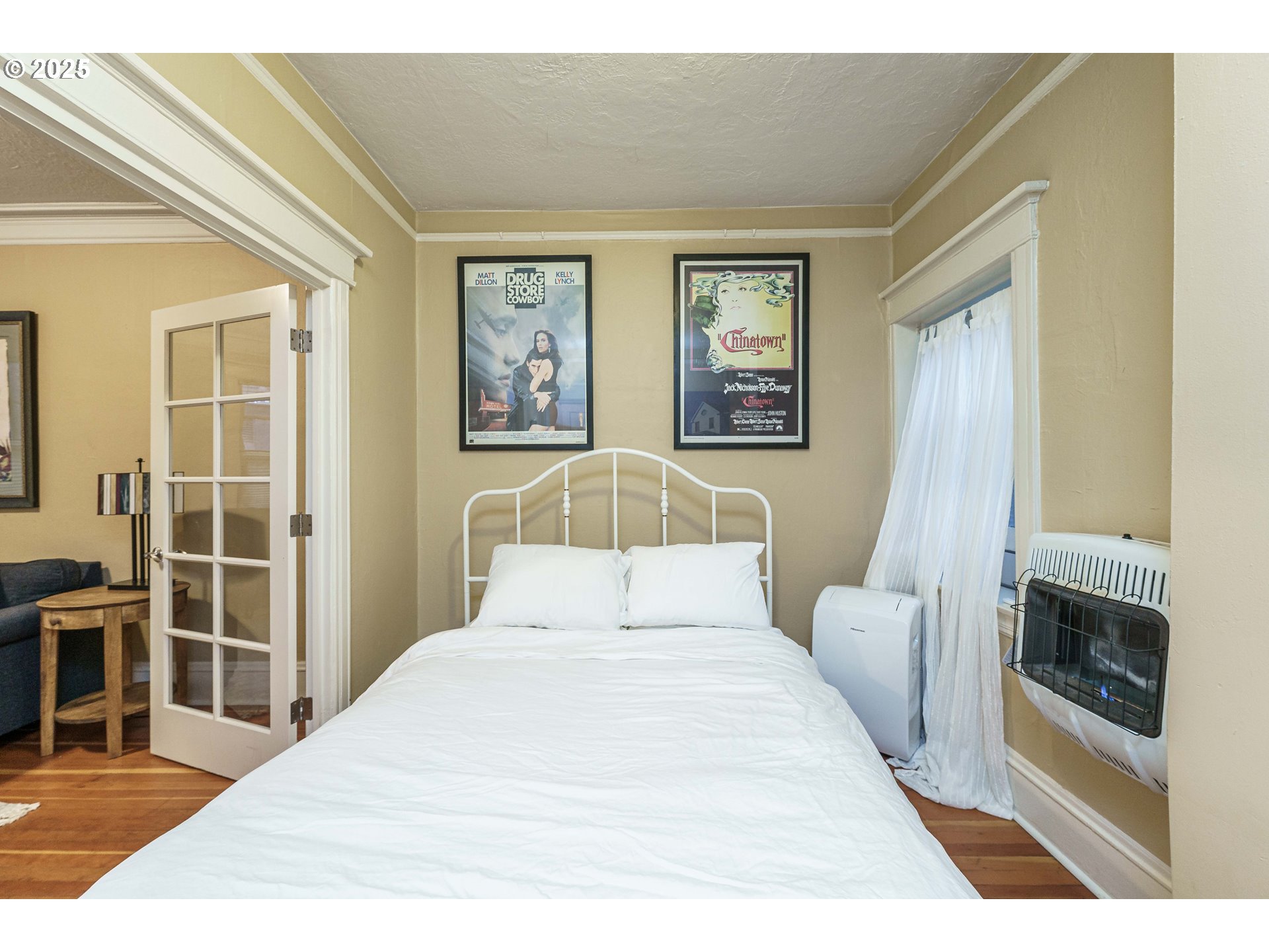 2109 Northwest Irving Street, Unit 114 Portland, OR 97210 - Photo 12 of 29 a bedroom with a large bed and a window