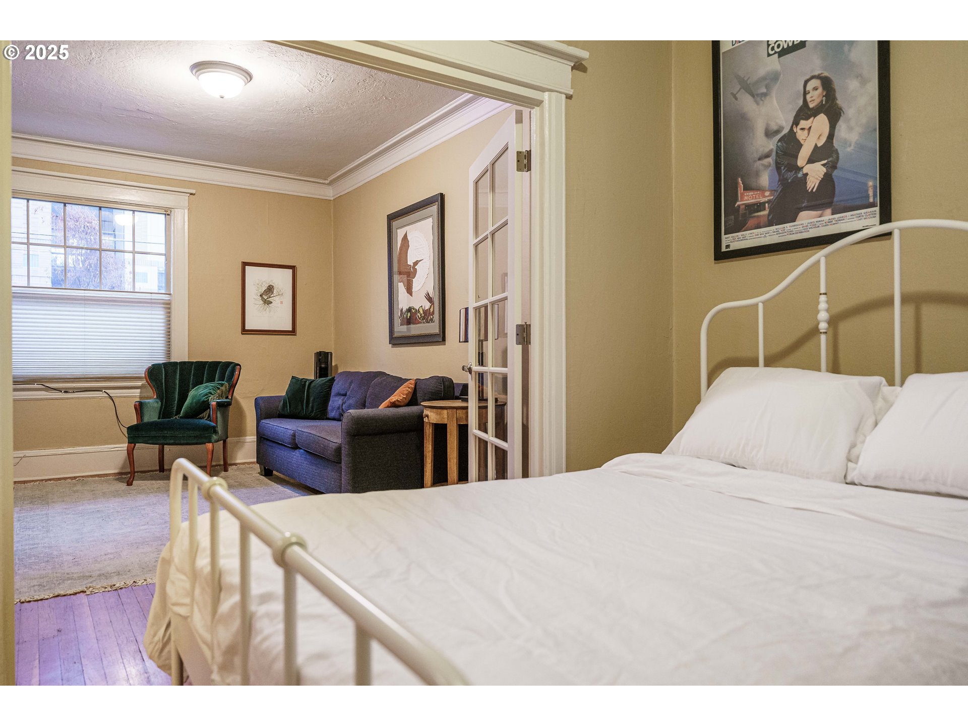 2109 Northwest Irving Street, Unit 114 Portland, OR 97210 - Photo 25 of 29 a bedroom with a bed and furniture
