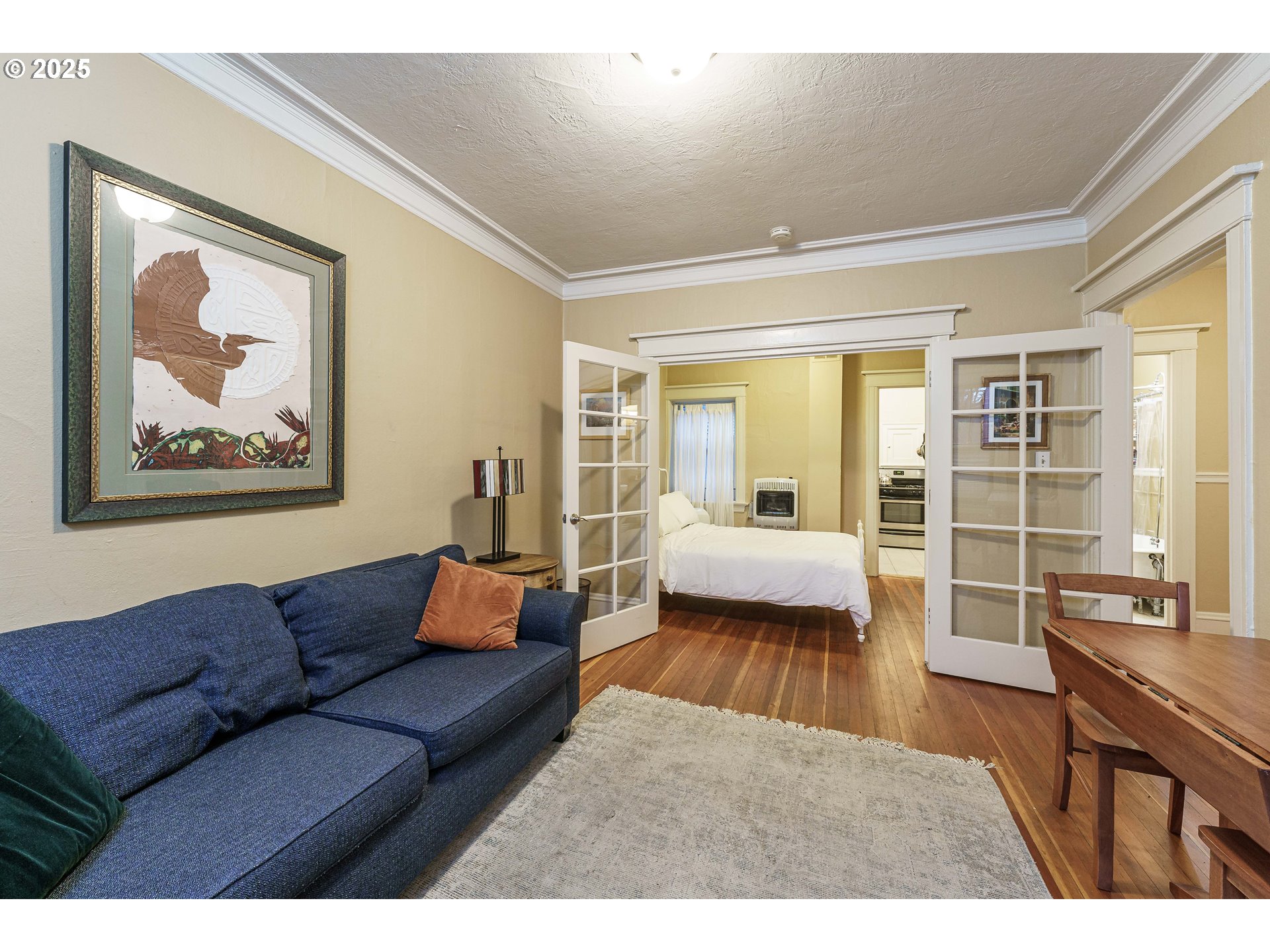 2109 Northwest Irving Street, Unit 114 Portland, OR 97210 - Photo 9 of 29 a living room with furniture and a large window