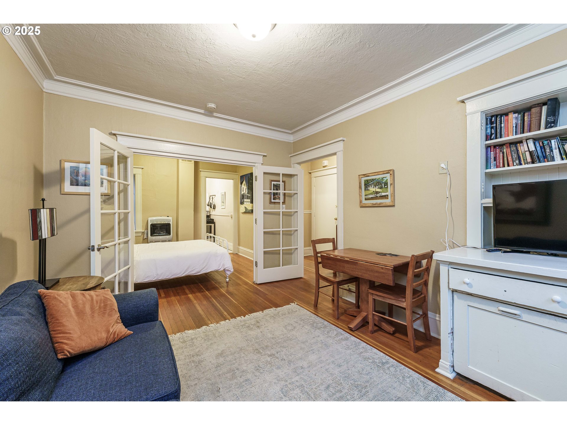 2109 Northwest Irving Street, Unit 114 Portland, OR 97210 - Photo 10 of 29 a living room with furniture and a flat screen tv