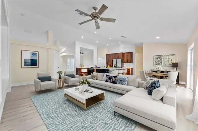 a living room with furniture rug and window