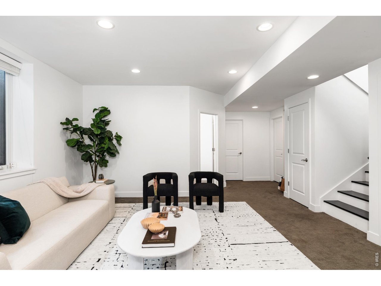 3963 Springleaf Lane Boulder, CO 80304 - Photo 23 of 32 The lower level expands the home s flexibility with tall ceilings, large egress windows, and a spacious recreation area suited for media, fitness, hobbies, or guests.