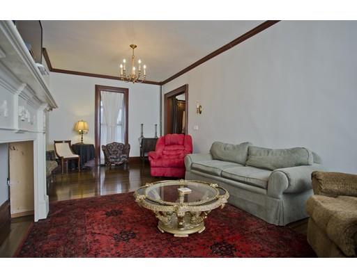 101 Westminster Street Springfield, MA 01109 - Photo 11 of 29 a living room with furniture a chandelier and a dining table