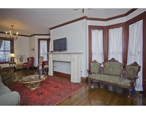 101 Westminster Street Springfield, MA 01109 - Photo 13 of 29 a living room with furniture a fireplace and a flat screen tv