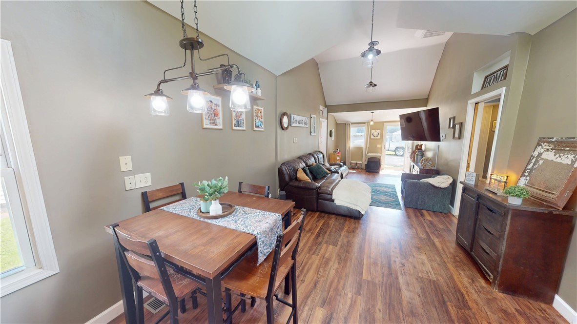 8 Chestnut Street Danville, IL 61832 - Photo 10 of 19 a view of a dining room with furniture a chandelier and wooden floor