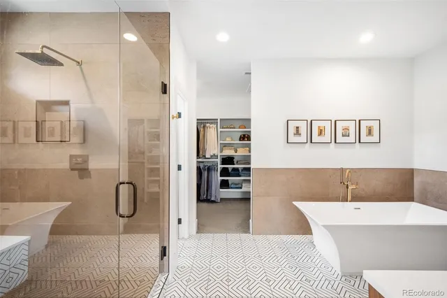 a bathroom with a bathtub and a shower