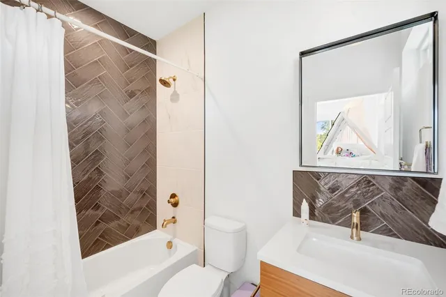 a bathroom with a toilet and a sink