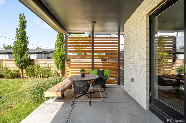 a balcony with furniture and garden