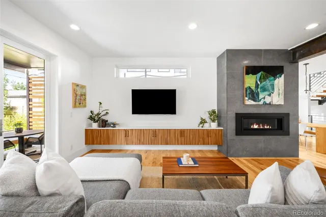 a living room with furniture and a fireplace