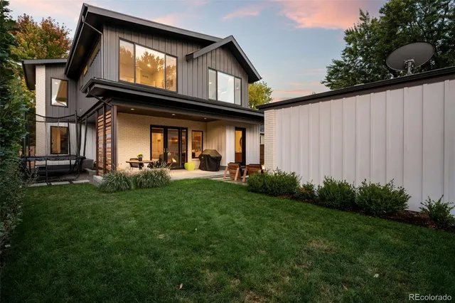 a view of a porch with furniture and garden