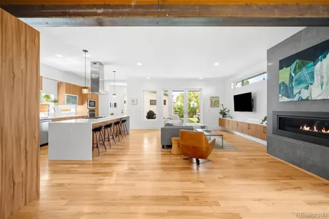 a kitchen with stainless steel appliances a sink stove and cabinets