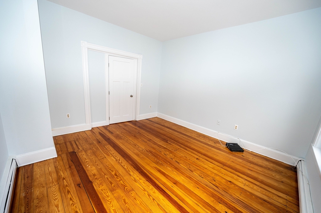 5 Colchester Street, Unit 2 Boston, MA 02136 - Photo 16 of 19 a view of a room with wooden floor