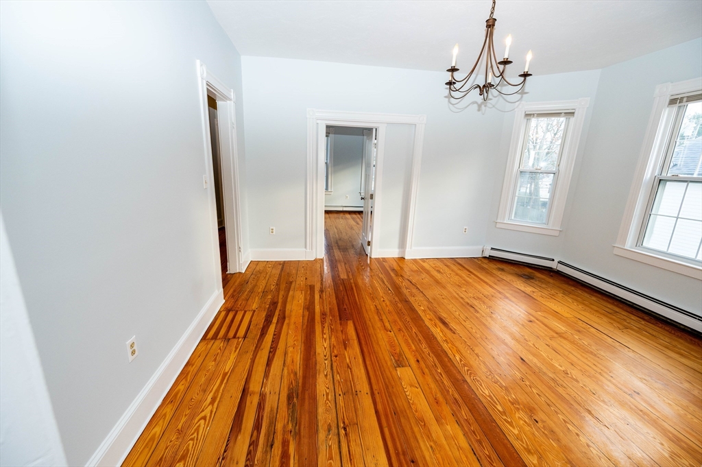 5 Colchester Street, Unit 2 Boston, MA 02136 - Photo 8 of 19 a view of a room with wooden floor and staircase