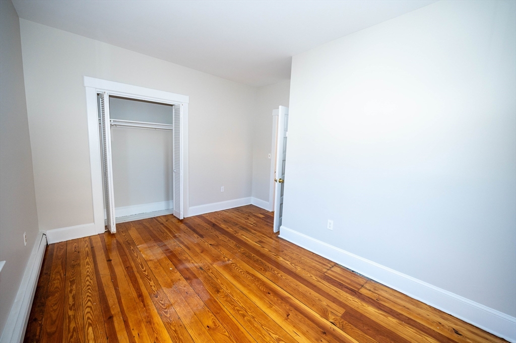 5 Colchester Street, Unit 2 Boston, MA 02136 - Photo 10 of 19 a view of a room with wooden floor and closet