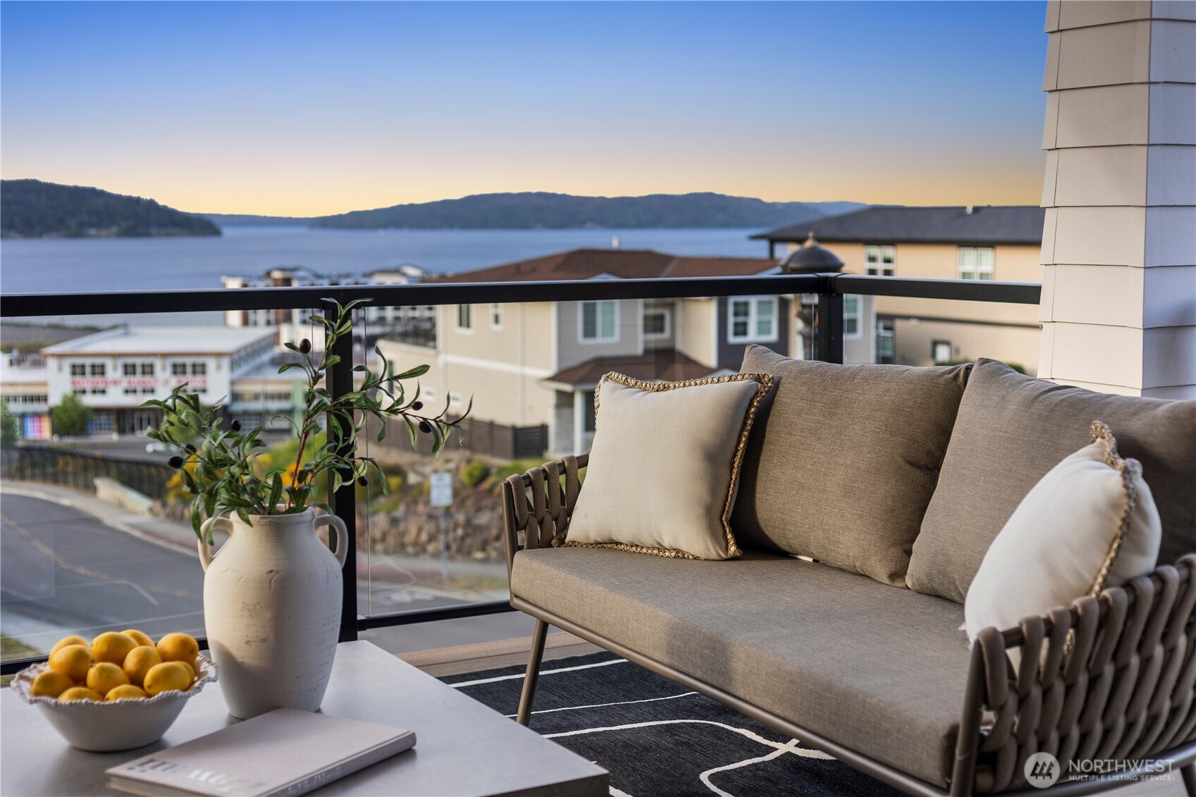 5301 North Commercial Street Ruston, WA 98407 - Photo 14 of 40 a balcony with furniture and a potted plant