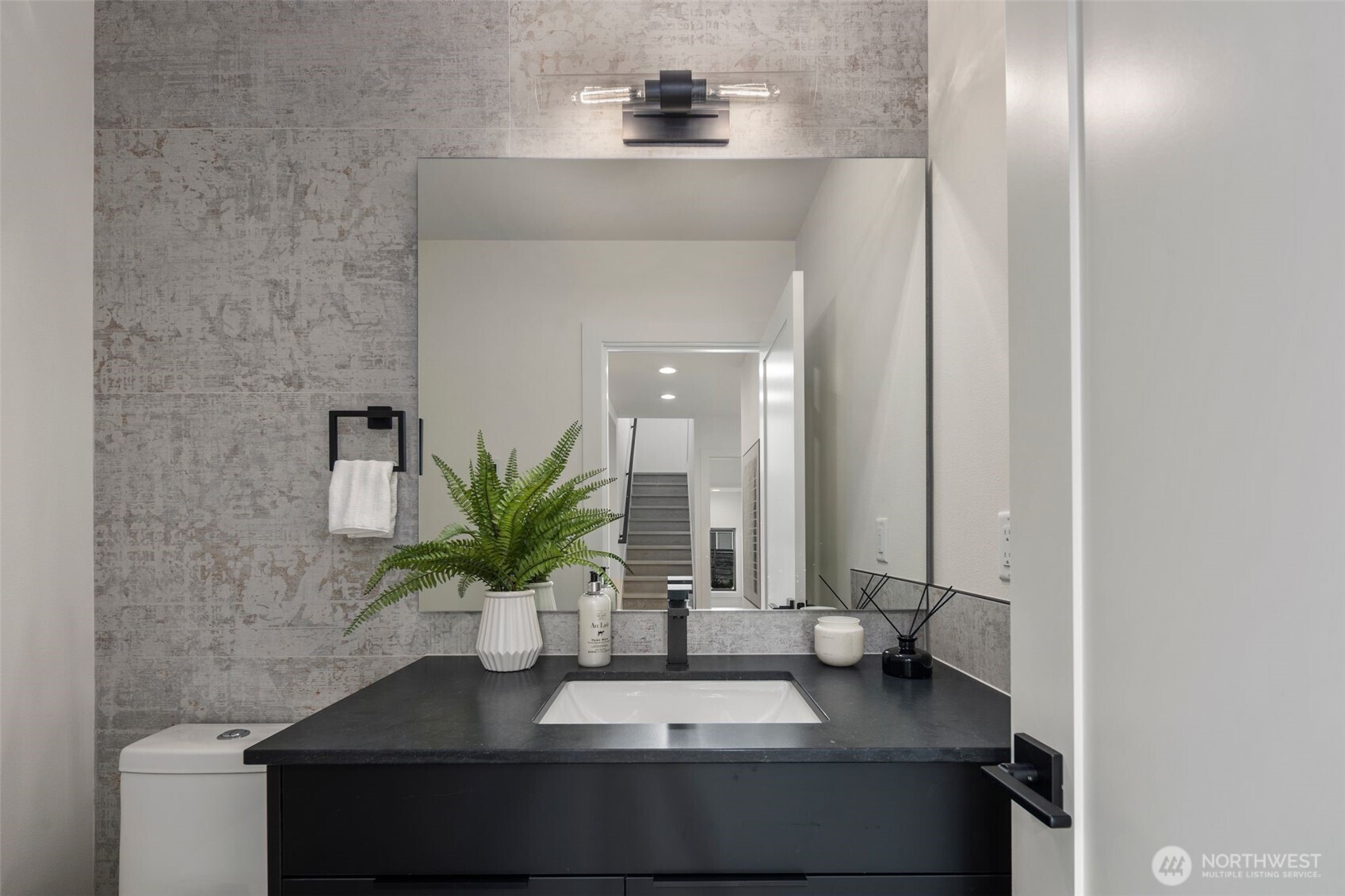 5301 North Commercial Street Ruston, WA 98407 - Photo 17 of 40 a bathroom with a sink and a mirror