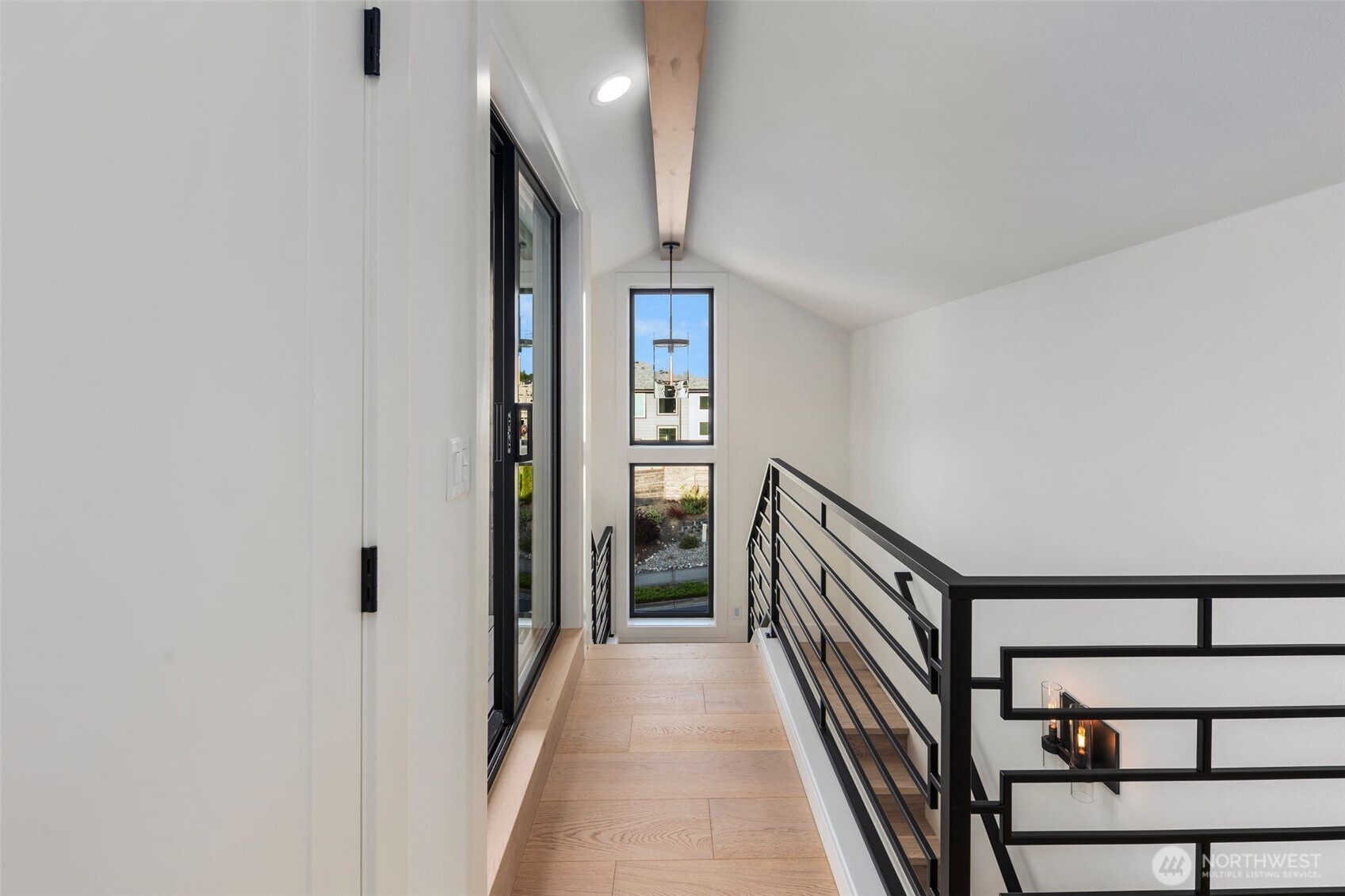 5301 North Commercial Street Ruston, WA 98407 - Photo 19 of 40 a view of a hallway with wooden floor and staircase
