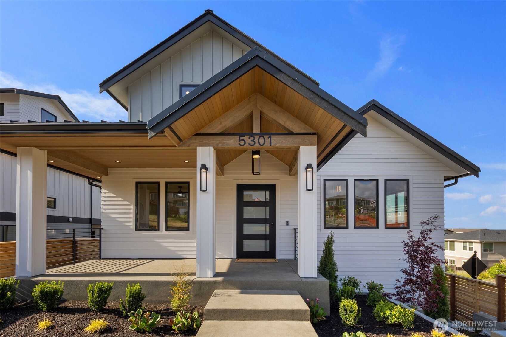 5301 North Commercial Street Ruston, WA 98407 - Photo 2 of 40 a front view of a house with a yard