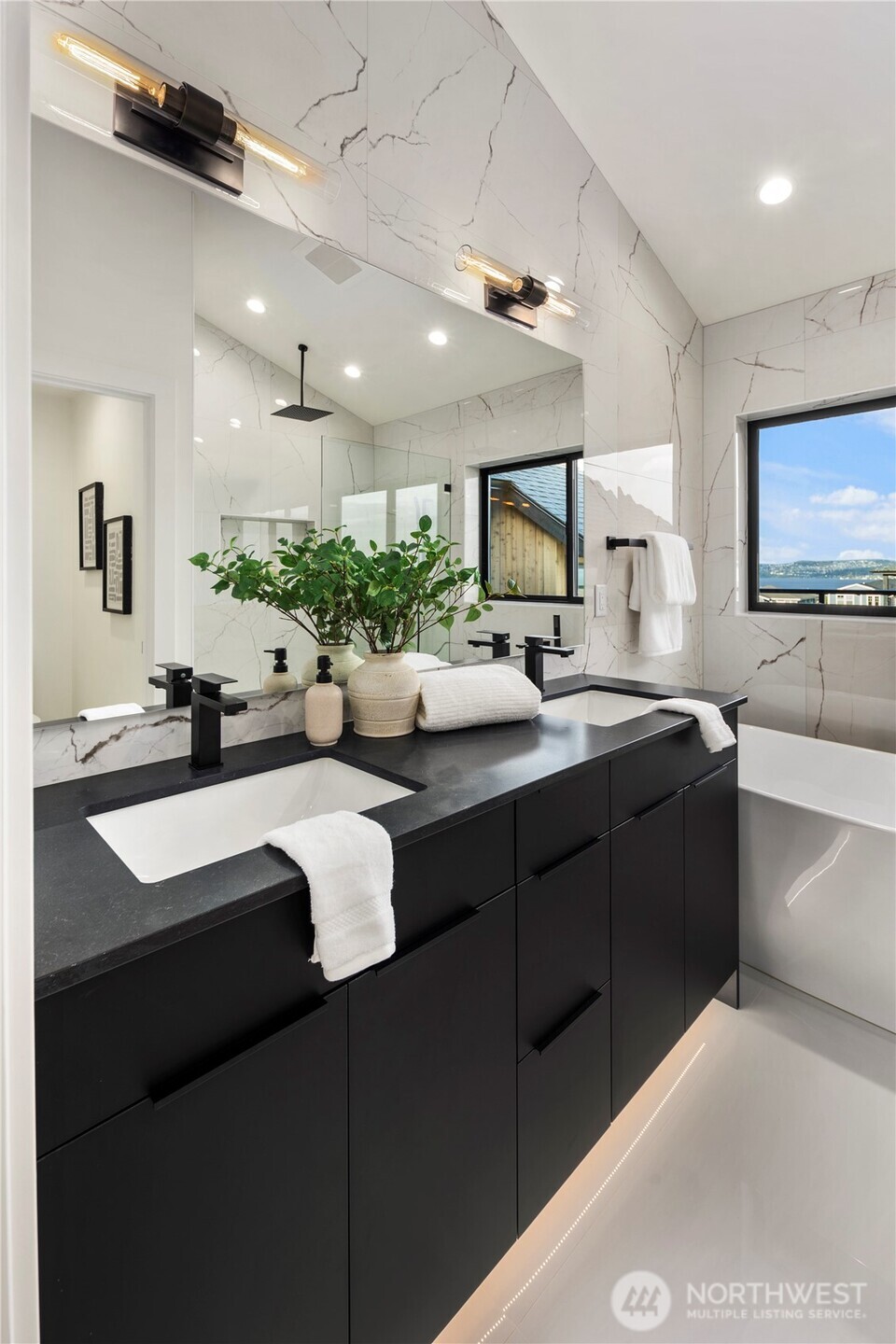 5301 North Commercial Street Ruston, WA 98407 - Photo 24 of 40 a kitchen with stainless steel appliances kitchen island granite countertop a sink and a refrigerator