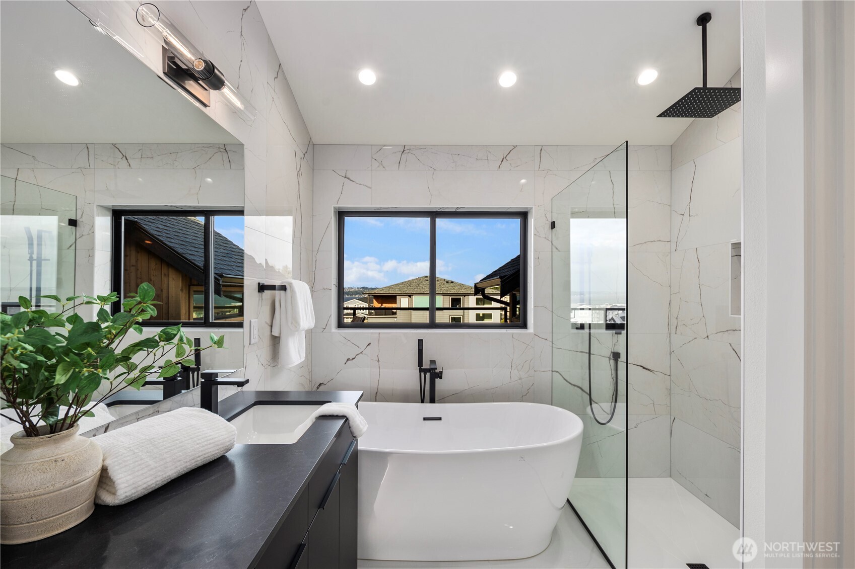5301 North Commercial Street Ruston, WA 98407 - Photo 25 of 40 a bathroom with a double vanity sink and a mirror