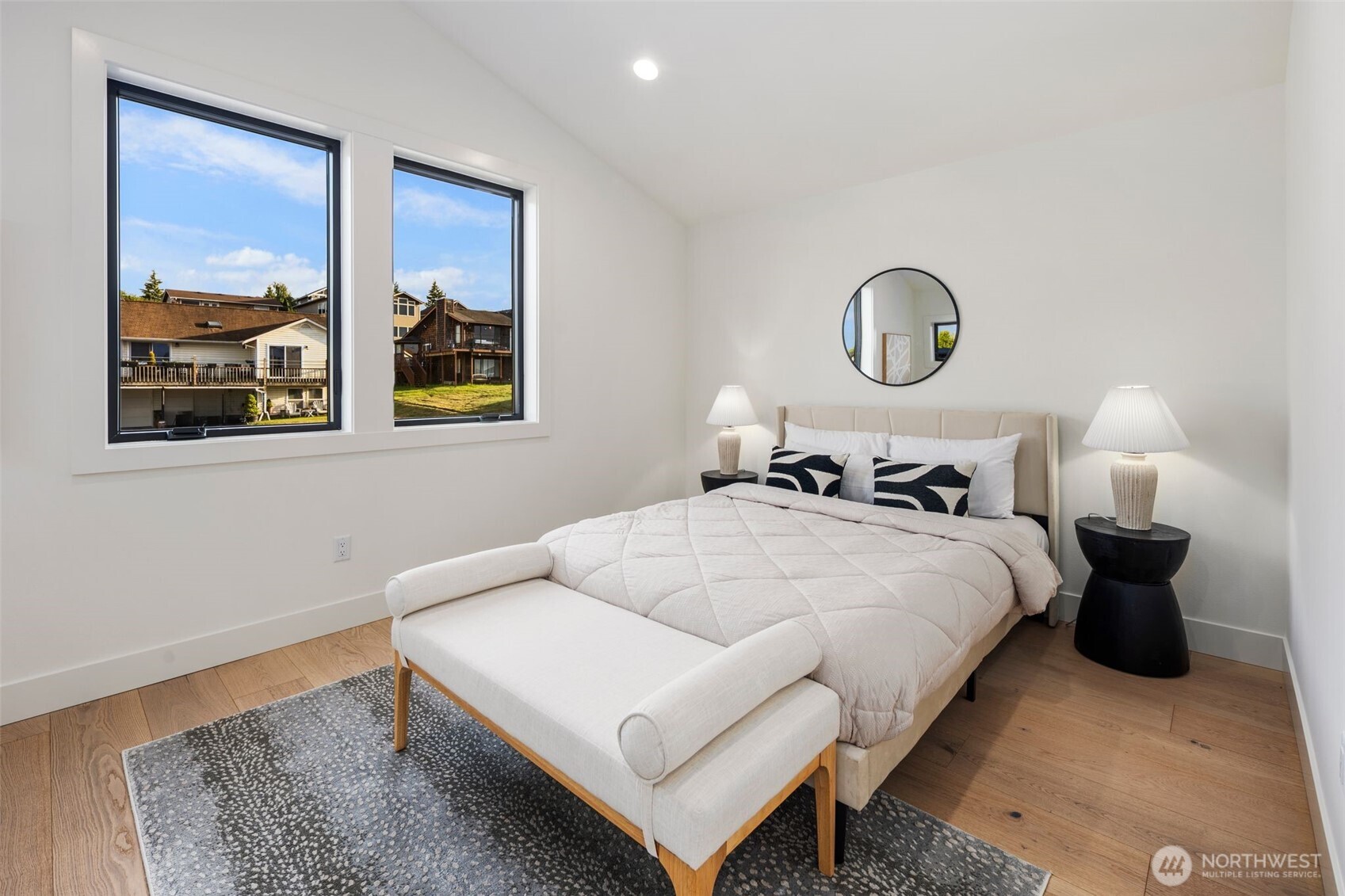 5301 North Commercial Street Ruston, WA 98407 - Photo 28 of 40 a bedroom with bed and a window