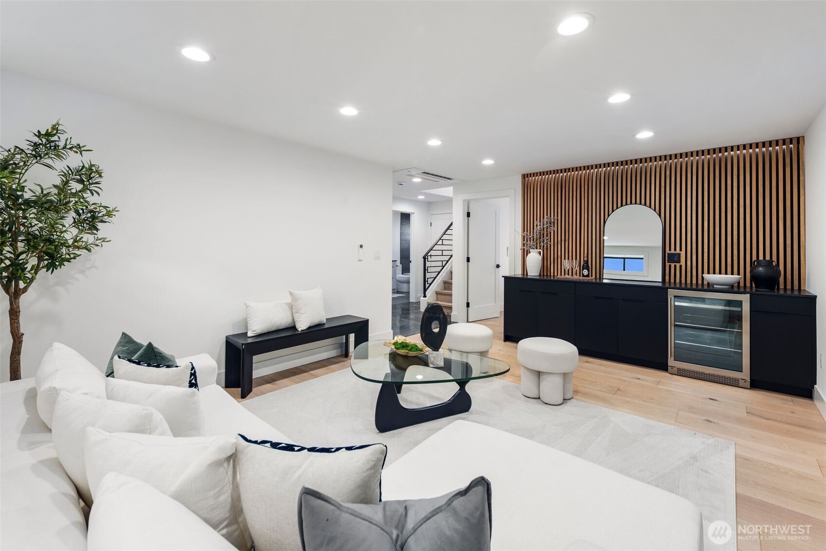 5301 North Commercial Street Ruston, WA 98407 - Photo 30 of 40 a living room with furniture and a wooden floor