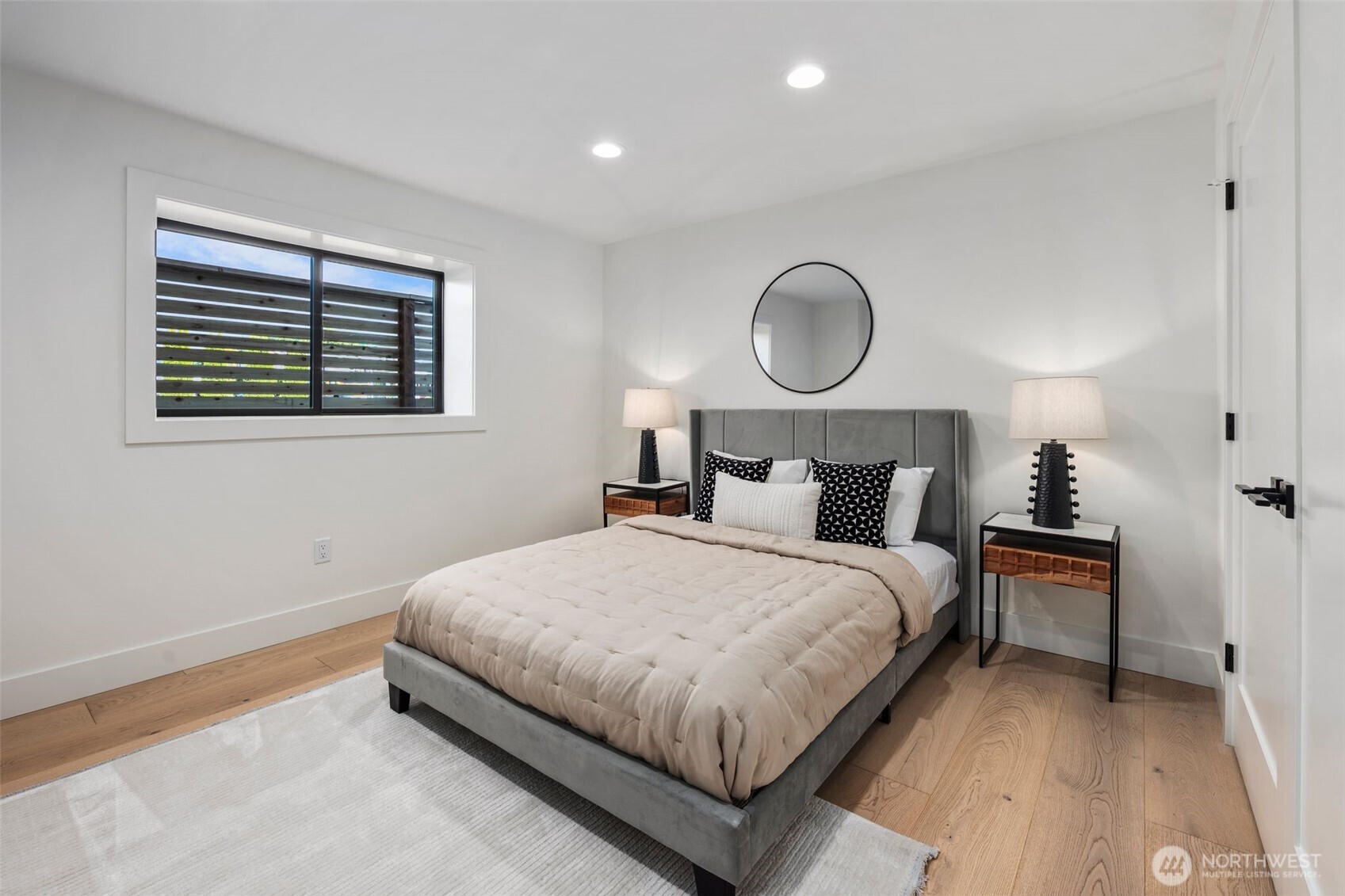 5301 North Commercial Street Ruston, WA 98407 - Photo 32 of 40 a bedroom with bed and a window