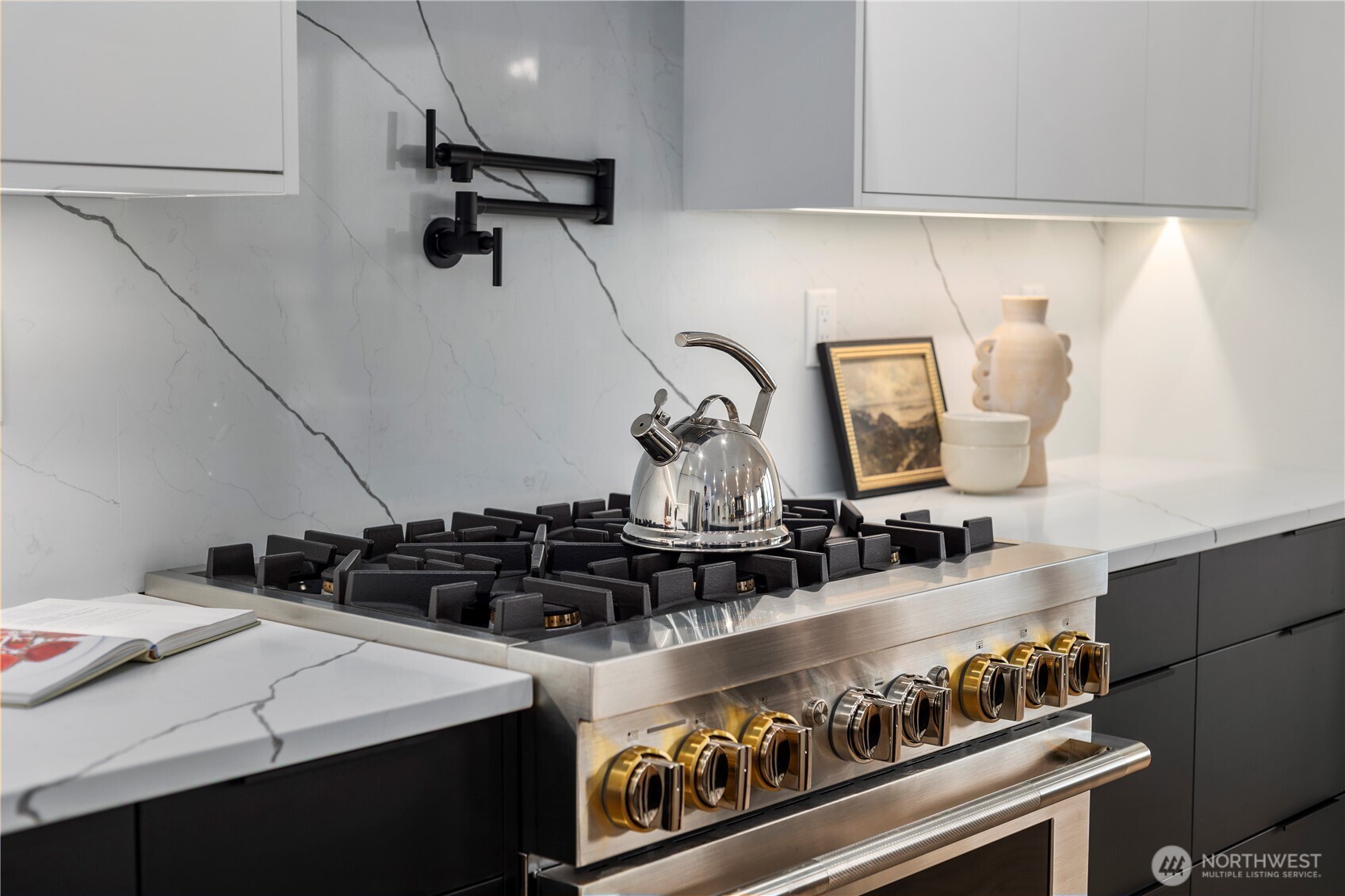 5301 North Commercial Street Ruston, WA 98407 - Photo 9 of 40 a kitchen with a stove and a sink