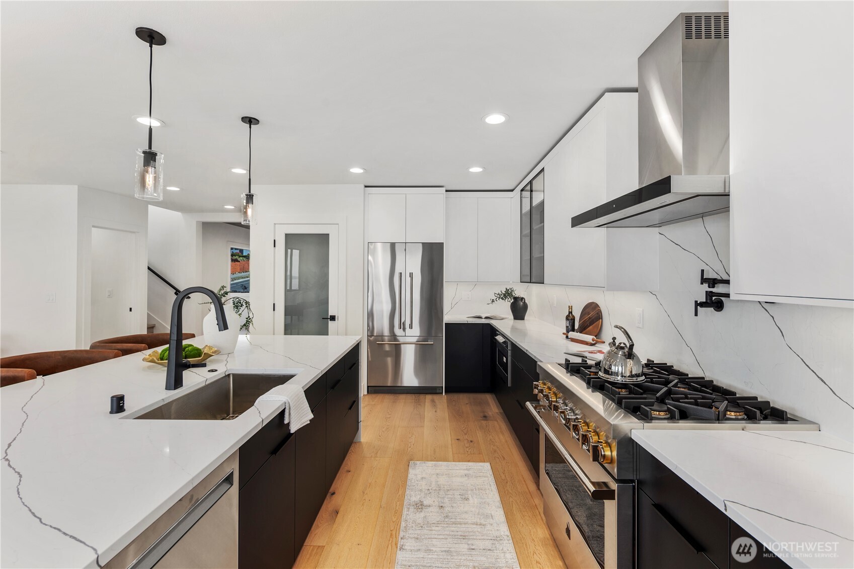 5301 North Commercial Street Ruston, WA 98407 - Photo 10 of 40 a kitchen with kitchen island a sink stove and refrigerator