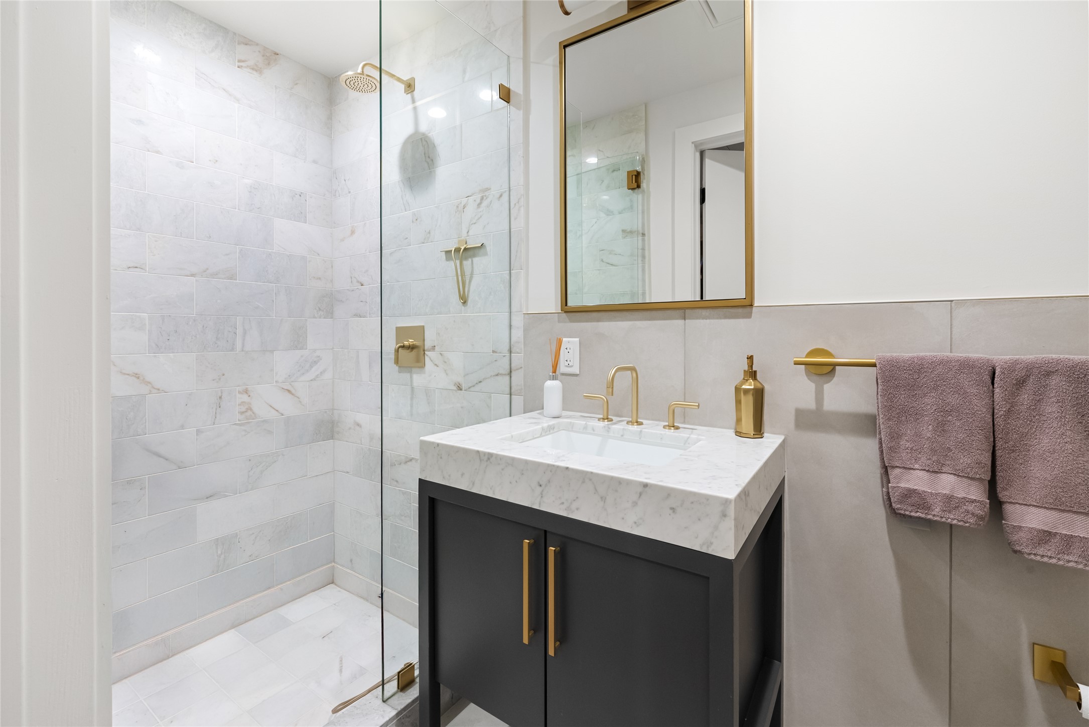 70 Rainey Street, Unit 2106 Austin, TX 78701 - Photo 10 of 26 a bathroom with a sink a toilet and shower