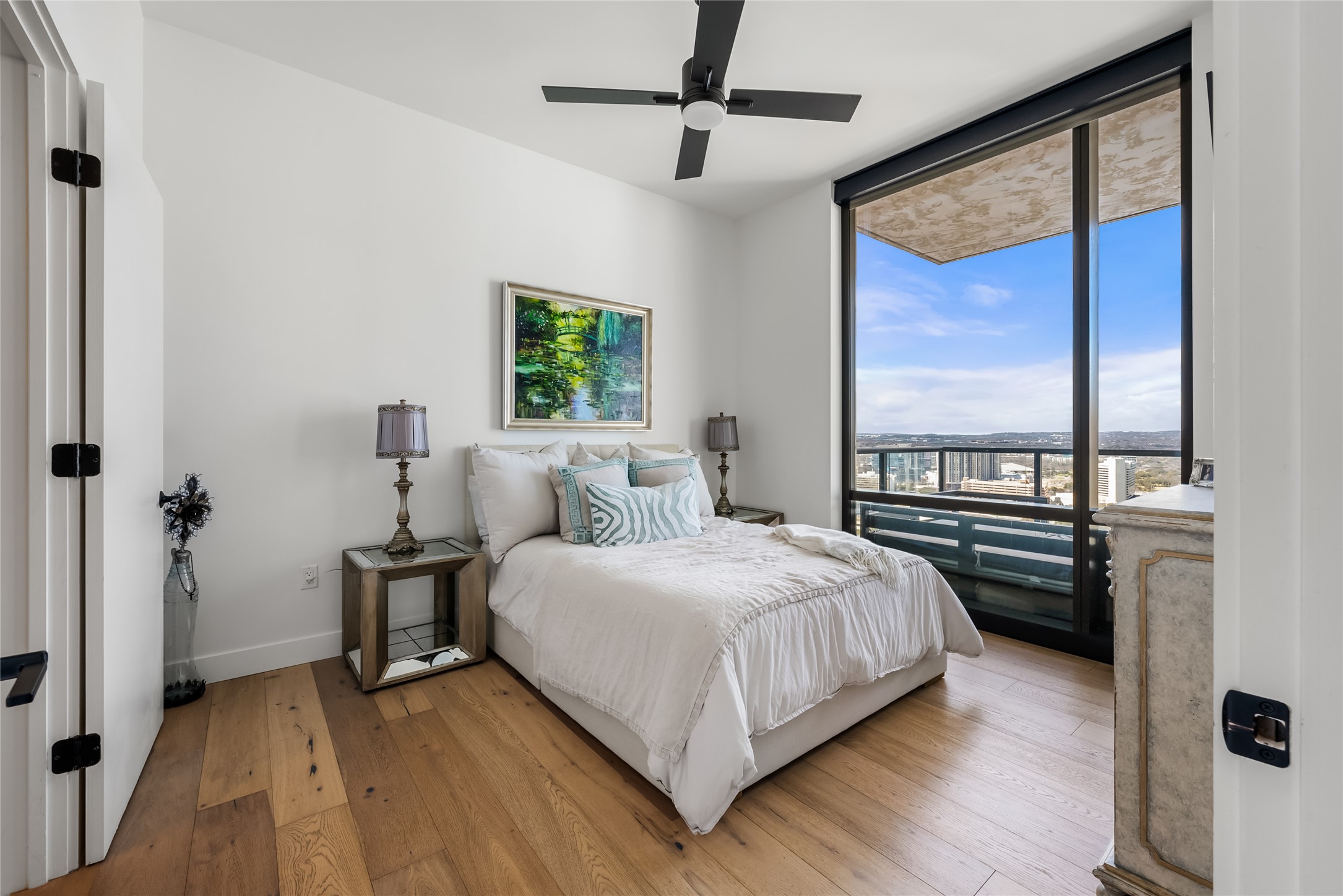 70 Rainey Street, Unit 2106 Austin, TX 78701 - Photo 8 of 26 a bedroom with a bed and a large window