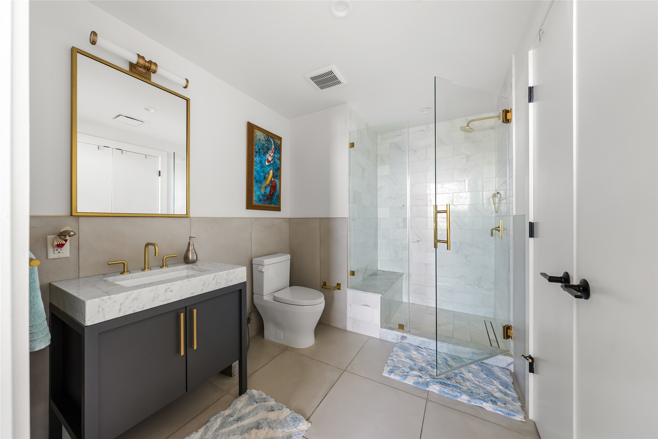 70 Rainey Street, Unit 2106 Austin, TX 78701 - Photo 9 of 26 a bathroom with a toilet sink and shower