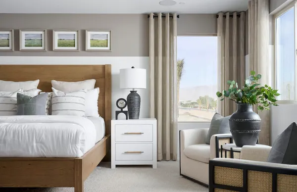 a bedroom with a bed and a couch