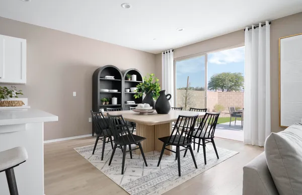 a view of a dining room with furniture and window