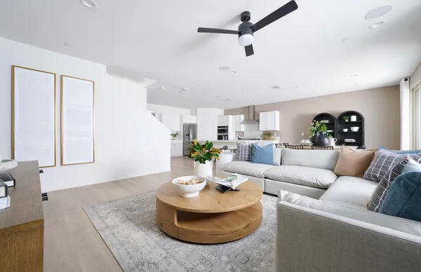 a living room with furniture and a rug