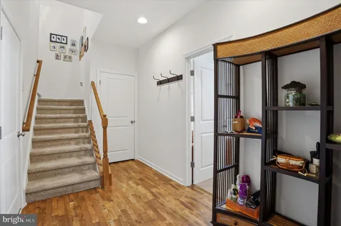 a view of a livingroom with wooden floor and closet