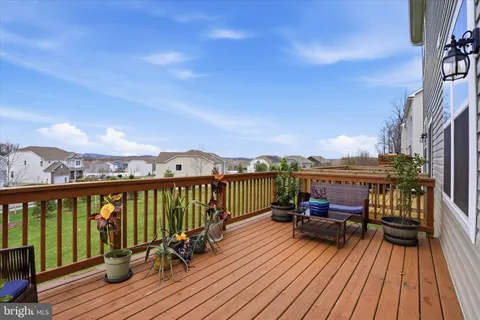 a view of roof deck with patio