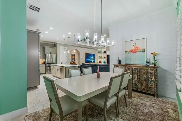 a view of a dining room and chandelier